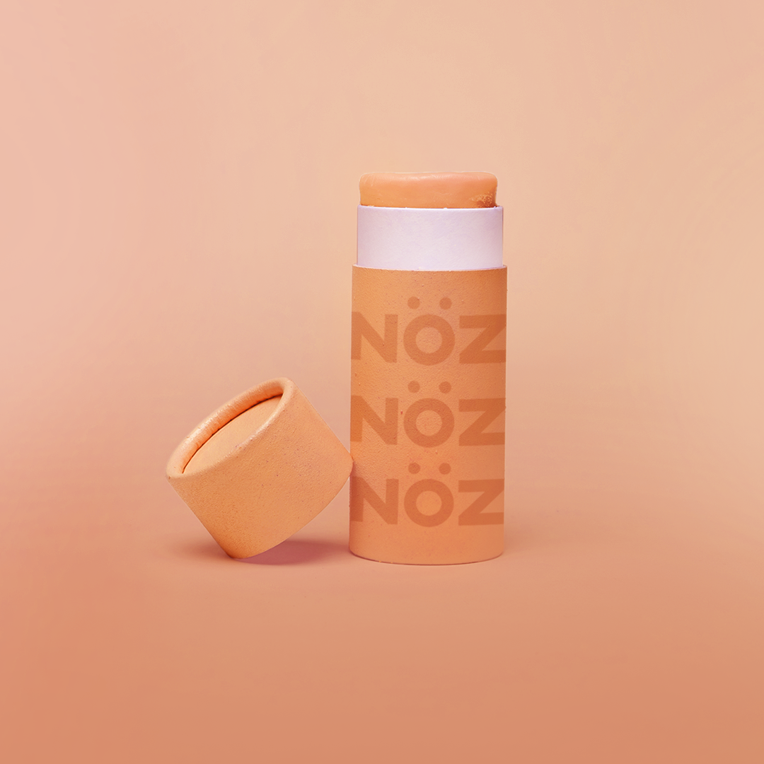 Nöz reef safe SPF sunscreen in orange.