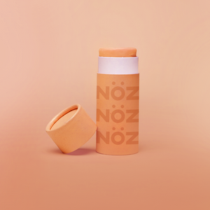 Nöz reef safe SPF sunscreen in orange.